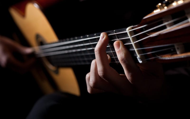 Man playing acoustic guitar